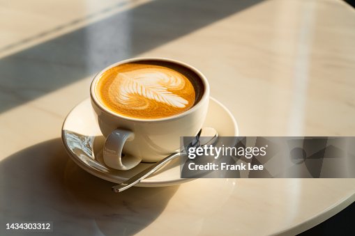 Feshly brewed latte coffee on a white table Feshly brewed latte coffee on a white table