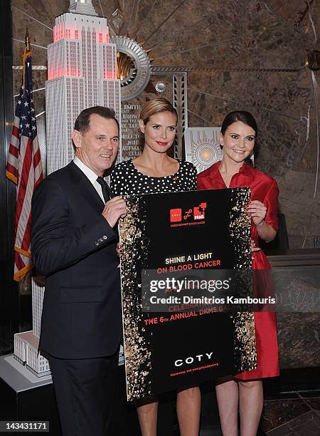 Coty Inc. Chief Executive Officer Bernd Beetz, model Heidi Klum and DKMS Americas Director of Special Projects Alina Suprunova attend the Heidi Klum...