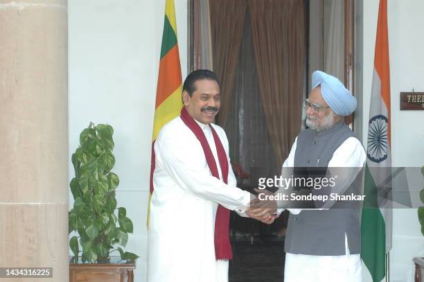Prime Minister Manmohan Singh greets Sri Lnaka President Mahinda Rajapaksa as they meet for bilateral talks in New Delhi.