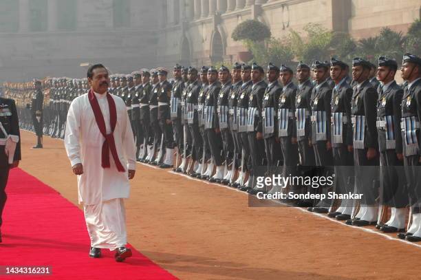 Sri Lanka President Mahinda Rajapaksa inspects a guard of honour from Indian military during a ceremonial reception in the Presidential Palace in New...