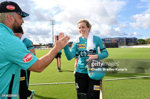 Georgia Redmayne of the Heat comes from the field after scoring 98 runs not out during the Women's Big Bash League match between the Brisbane Heat...