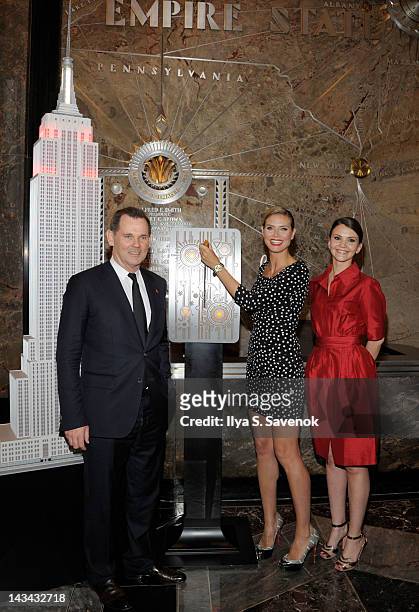 Bernd Beetz, Heidi Klum and Alina Suprunova visit the Empire State Building Lighting Ceremony honoring DKMS on April 26, 2012 in New York City.
