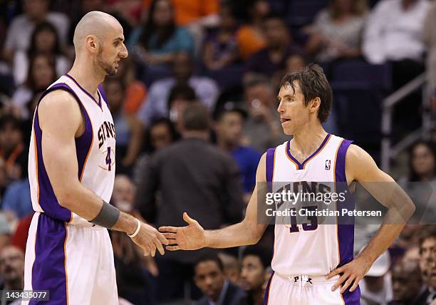 Steve Nash of the Phoenix Suns high-fives Marcin Gortat during the NBA game against the San Antonio Spurs at US Airways Center on April 25, 2012 in...