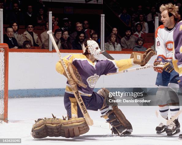 Mario Lessard of the LA Kings makes a glove save during a game... News ...