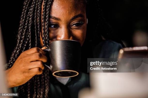 young woman on a coffee break from studying using smart phone for fun - meme text stock pictures, royalty-free photos & images