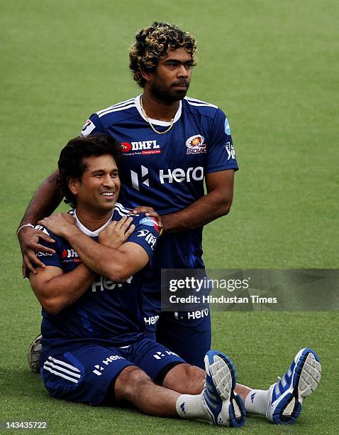 Mumbai Indians players Sachin Tendulkar and Lasith Malinga during the practice session at Ferozshah Kotla ground on April 26, 2012 in New Delhi,...