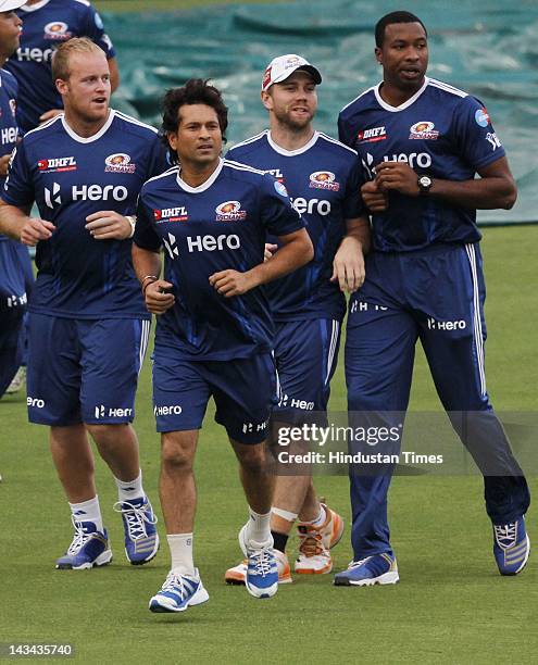 Mumbai Indians players Sachin Tendulkar and teammates during the practice session at Ferozshah Kotla ground on April 26, 2012 in New Delhi, India....