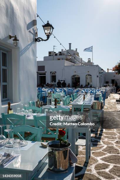 restaurants at naoussa harbor, paros, cyclades, greece - paros greece stock pictures, royalty-free photos & images