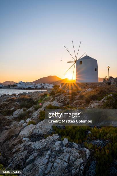 windmill at sunrise, paros, cyclades, greece - paros greece stock pictures, royalty-free photos & images