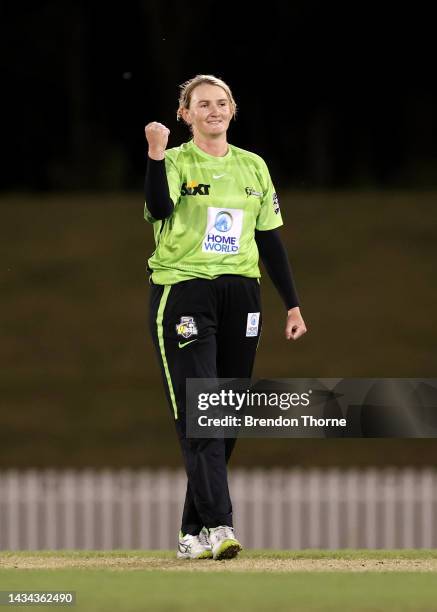 Sammy-Jo Johnson of the Thunder celebrates after claiming the wicket of Heather Graham of the Hurricanes during the Women's Big Bash League match...