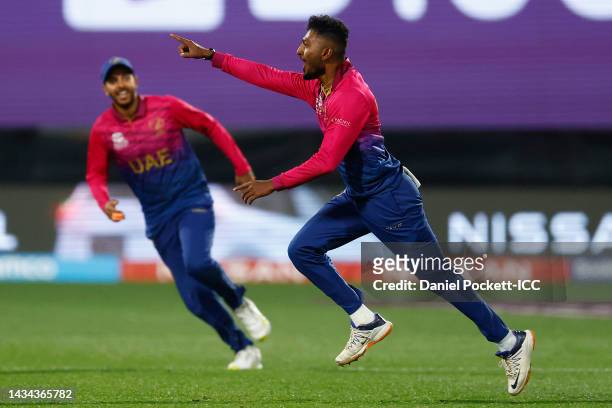 Karthik Meiyappan of the United Arab Emirates celebrates with team mates after taking a hat-trick, dismissing Dasun Shanaka of Sri Lanka for a duck...