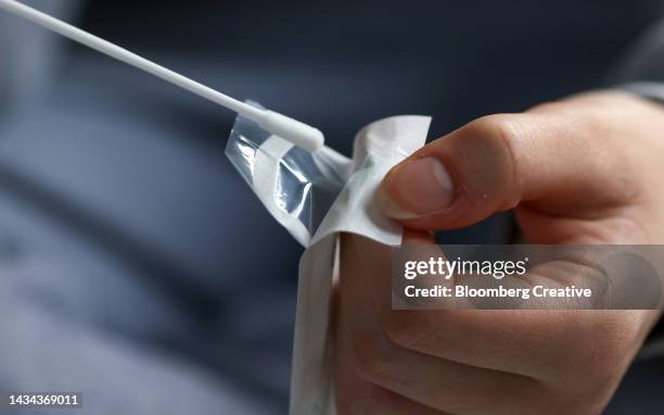 a covid-19 lateral flow self-test kit - cotton swab stock pictures, royalty-free photos & images