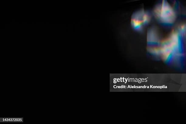 colourful rainbow light leaks texture on black background - distress flare stock pictures, royalty-free photos & images