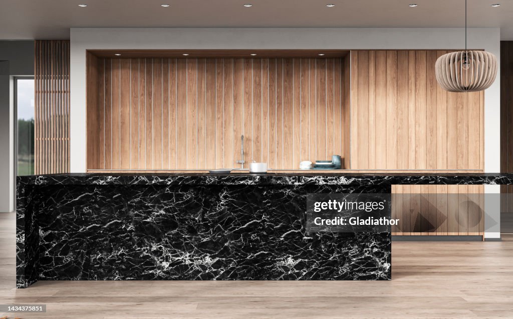 A close up of a modern white kitchen with rectangular black marble breakfast kitchen island