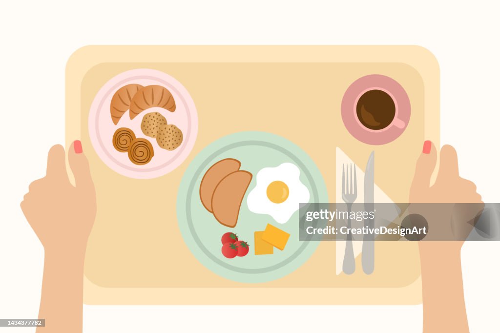 High Angle View Of Woman Hand Holding Breakfast Tray