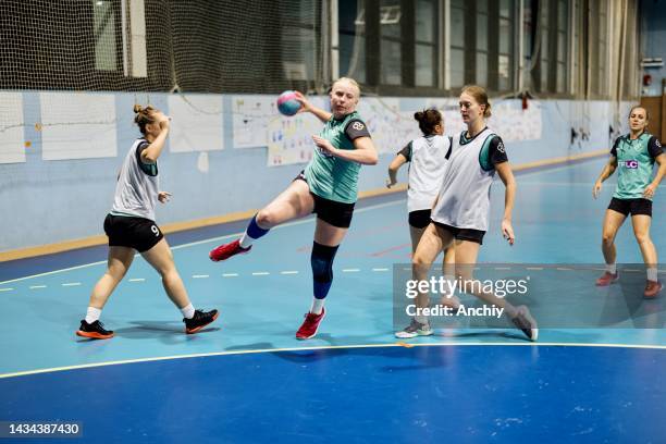 female players perform an attacking practice during handball training - handball stock pictures, royalty-free photos & images