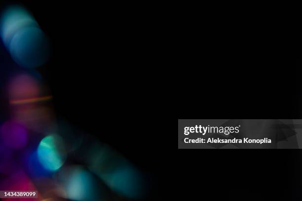 colorful neon holographic light leaks on black background - led texture stock pictures, royalty-free photos & images
