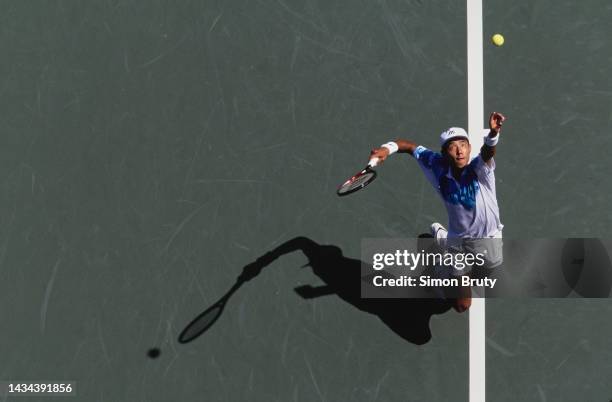 Shuzo Matsuoka from Japan keeps his eyes on the tennis ball as he serves to Petr Korda of the Czech Republic during their Men's Singles First Round...