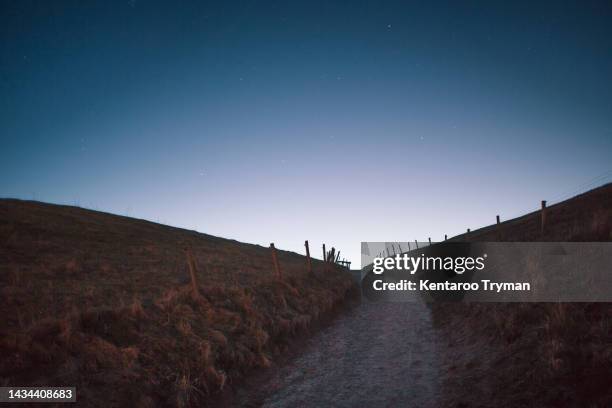 a path through pastures at night - zweden stock pictures, royalty-free photos & images