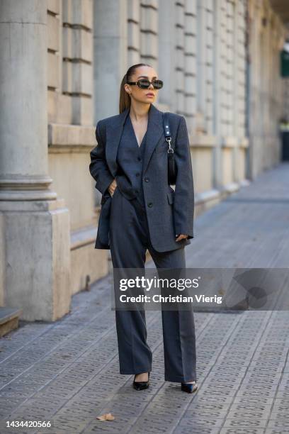 Anna Idriess wears grey blazer & vest Mango, pants Storets, black pointed heels Zara, bag Celine, sunglasses, Celine on October 17, 2022 in...