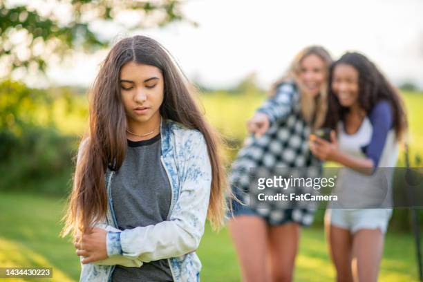 teen girls bullying and teasing - anti bullying stock pictures, royalty-free photos & images