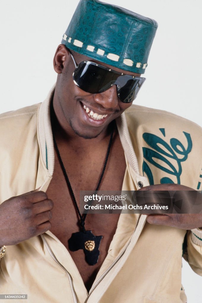Koolu Rapper Rapper Kool Moe Dee opening his shirt to show his Africa medallion ...