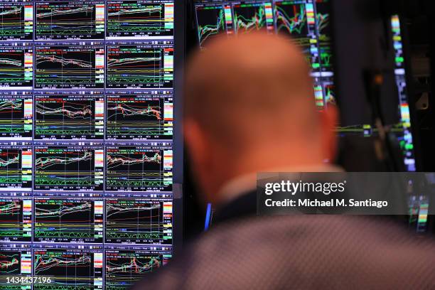 Traders work on the floor of the New York Stock exchange during morning trading on October 18, 2022 in New York City. The stock market opened on an...