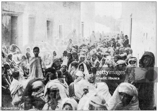 antique image: crowded street, algeria - algeria stock illustrations