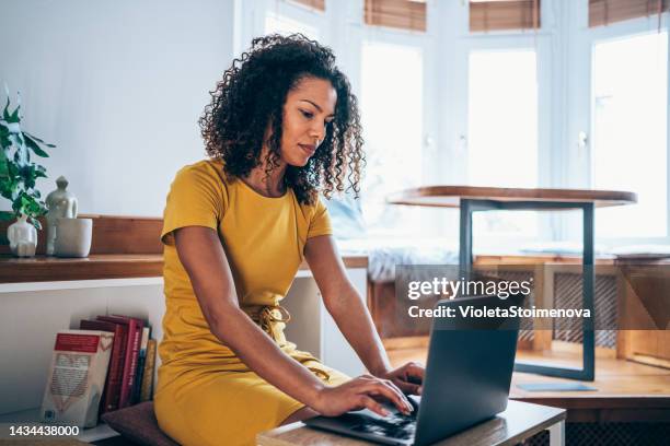 successful businesswoman in modern office working on laptop. - blogging stock pictures, royalty-free photos & images