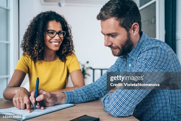 business people signing a contract. - grant writer stock pictures, royalty-free photos & images