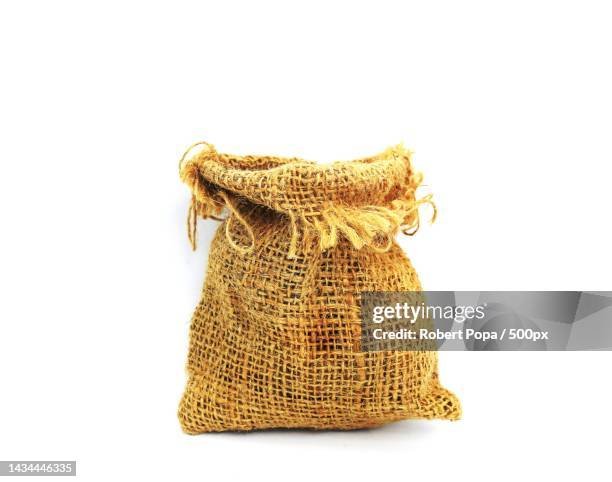 empty burlap sack bag isolated on white background - drawstring bag stock pictures, royalty-free photos & images