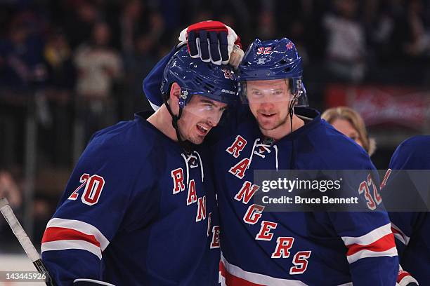 Chris Kreider and Anton Stralman of the New York Rangers celebrate their 2 to 1 win over the Ottawa Senators in Game Seven of the Eastern Conference...