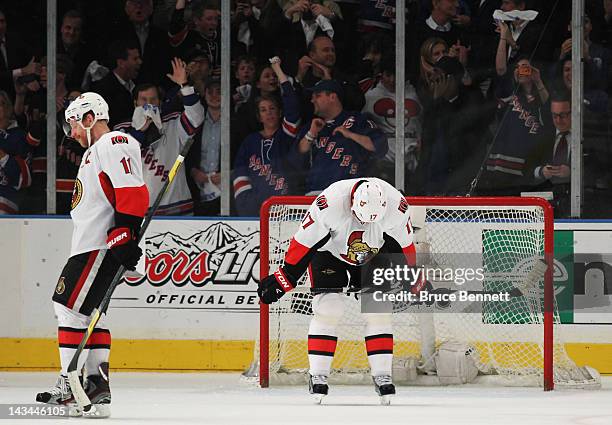 Daniel Alfredsson and Filip Kuba of the Ottawa Senators react to their 2 to 1 loss to the New York Rangers in Game Seven of the Eastern Conference...