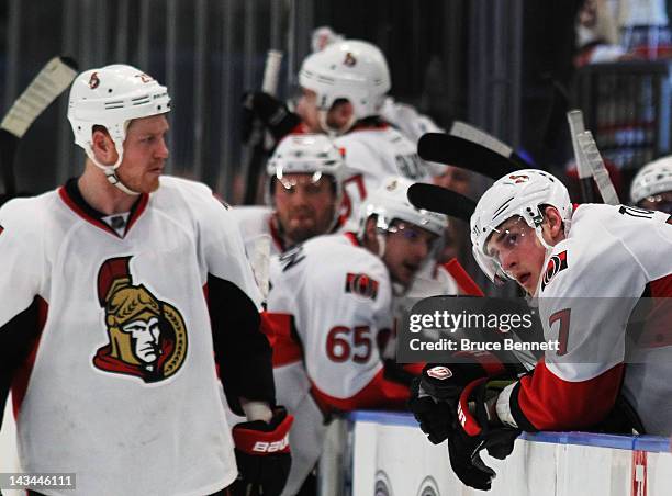 Kyle Turris and Chris Neil of the Ottawa Senators react to their 2 to 1 loss to the New York Rangers in Game Seven of the Eastern Conference...