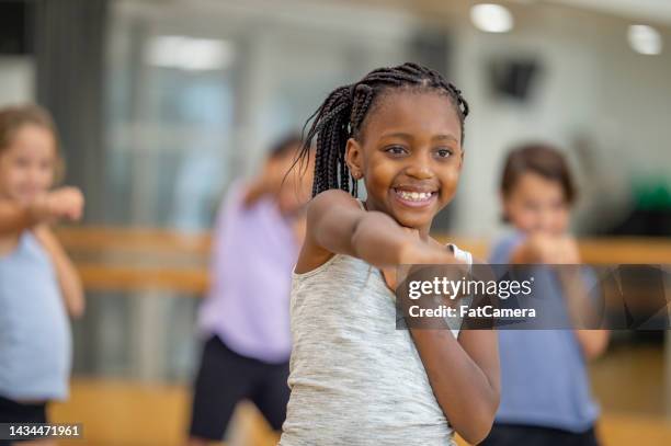 children's fitness class - girl in gym stock pictures, royalty-free photos & images