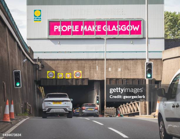 cars entering the clyde tunnel in glasgow - dashboard camera point of view stock pictures, royalty-free photos & images