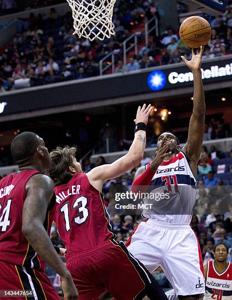 Washington Wizards small forward Chris Singleton shoots over Miami Heat shooting guard Mike Miller during the second half of their game played at the...