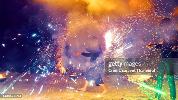 fire show on the beach at nakhon si thammarat province, thailand, october 14, 2022 - life si a beach stock pictures, royalty-free photos & images