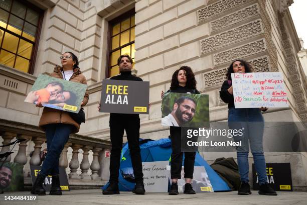 Sanaa Seif , the sister of Alaa el-Fattah, stands with other supporters as they hold a protest calling for his release at the Foreign & Commonwealth...