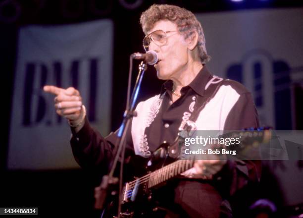 American singer-songwriter and rockabilly pioneer Carl Perkins , performs on stage at the South by Southwest Music Festival in Austin, Texas on March...