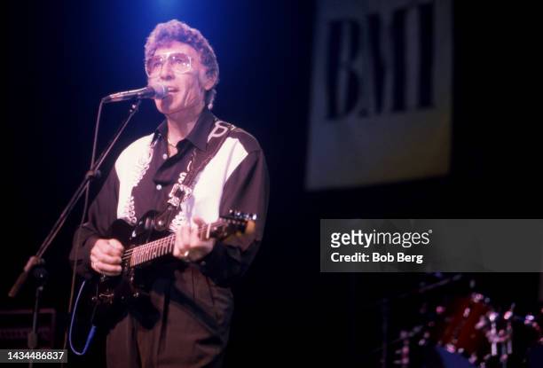 American singer-songwriter and rockabilly pioneer Carl Perkins , performs on stage at the South by Southwest Music Festival in Austin, Texas on March...