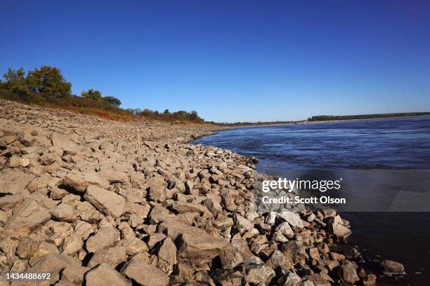 Rocks are exposed by retreating water along the banks of the Mississippi River on October 18, 2022 near Marston, Missouri. Lack of rain in the Ohio...