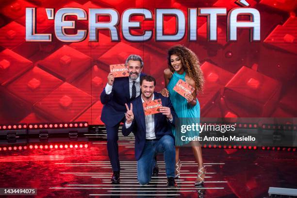 Flavio Insinna, Andrea Cerelli and Samira Lui pose for a session for the "L'Eredità" Rai Tv Show at Rai Studios on October 18, 2022 in Rome, Italy.