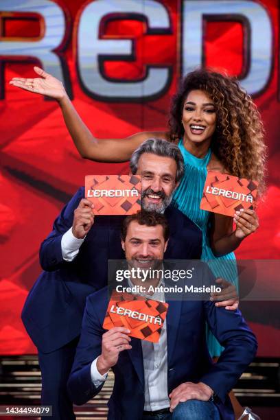 Flavio Insinna, Andrea Cerelli and Samira Lui pose for a session for the "L'Eredità" Rai Tv Show at Rai Studios on October 18, 2022 in Rome, Italy.