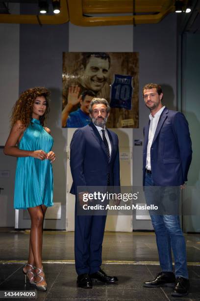 Andrea Cerelli, Flavio Insinna and Samira Lui pose for a session for the "L'Eredità" Rai Tv Show, in front of a poster in memory of Fabrizio Frizzi,...