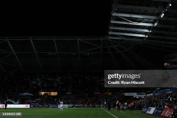 General view as fans and players wait for play to resume after power issues effect the stadium lighting during the Sky Bet Championship between...