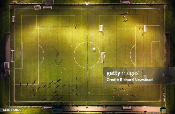 floodlit football training - football strategy stock pictures, royalty-free photos & images