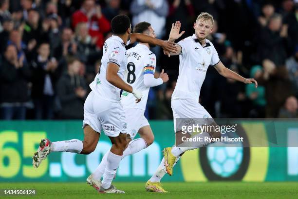 Harry Darling of Swansea City celebrates scoring their side's first goal with teammate Ben Cabango during the Sky Bet Championship between Swansea...