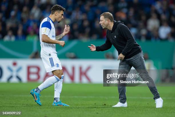 Frank Kramer of Schalke gives directions to Jordan Larsson during the DFB Cup second round match between TSG Hoffenheim and FC Schalke 04 at...