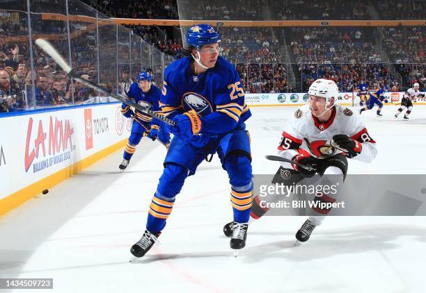 Owen Power of the Buffalo Sabres skates against Jake Sanderson of the Ottawa Senators during an NHL game on October 13, 2022 at KeyBank Center in...